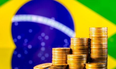 A,Stack,Of,Gold,Coins,On,The,Background,Of,The